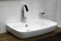 White washbasin and chrome tap Royalty Free Stock Photo