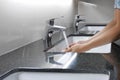 White washbasin and faucet on counter with hand washing Royalty Free Stock Photo