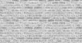 White washed brick wall texture. Rough gray brickwork. Whitewashed vintage background Royalty Free Stock Photo