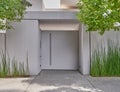 White washed modern house entrance metallic door