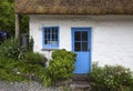 White-washed, stone cottage with thatched roof, Cadgwith, Cornwall, England Royalty Free Stock Photo