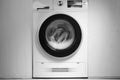 White washing machine with suds in bathroom Royalty Free Stock Photo