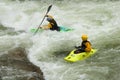 White water kayaking by small water falls Royalty Free Stock Photo