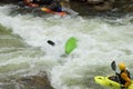 White water kayaking by small water falls Royalty Free Stock Photo