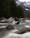 White water rapids illuminated by a slow shutter drag in a fast river. Royalty Free Stock Photo