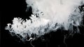 White watercolor ink in water on a black background. Waves of milky ink and splashes of white paints in the water Royalty Free Stock Photo