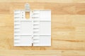 White watercolor palette. Empty watercolor tray isolated on wood background Royalty Free Stock Photo