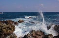 White waves rise after hitting the rocks in ocean Royalty Free Stock Photo