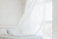 White waving curtain in white bedroom Royalty Free Stock Photo