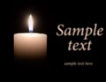 White wax candle is lit in the dark Royalty Free Stock Photo