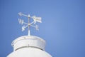 White weather vane on the roof Royalty Free Stock Photo