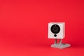 white webcam on red background, object, Internet, technology con Royalty Free Stock Photo