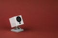 White webcam on red background, object, Internet, technology concept Royalty Free Stock Photo