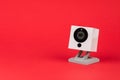 White webcam on red background, object, Internet, technology concept Royalty Free Stock Photo
