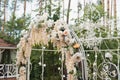 White wedding arch decorated with flower outdoors