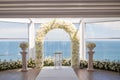 White wedding arch decorated with flowers Royalty Free Stock Photo