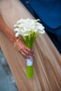 White wedding bouquet of calla in hands bride Royalty Free Stock Photo