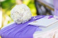 White wedding bouquet and a marriage certificate