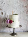 White Wedding Cake with Bride and Groom Figure Topper Royalty Free Stock Photo