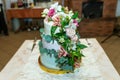 White wedding cake decorated by flowers fruits Royalty Free Stock Photo