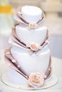 White wedding cake decorated with sugar flowers