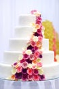 White wedding cake decorated with sugar flowers