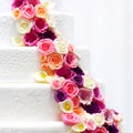 White wedding cake decorated with sugar flowers