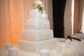 White wedding cake with flowers decorating the top