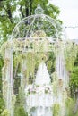 White wedding cake in outdoor garden Royalty Free Stock Photo