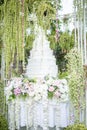 White wedding cake in outdoor garden Royalty Free Stock Photo