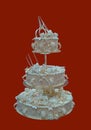 White Wedding Cakes beautifully decorated with cream flowers and yellow sprinkles. Royalty Free Stock Photo