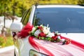 White wedding car decorated with fresh flowers. Wedding decorations Royalty Free Stock Photo