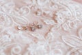 White Wedding dress on bed sheet close-up Royalty Free Stock Photo