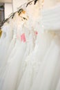 White wedding dresses hanging on racks Royalty Free Stock Photo