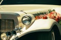 White wedding limousine decorated with flowers Royalty Free Stock Photo