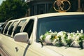 White wedding limousine decorated with flowers Royalty Free Stock Photo