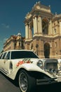 White wedding limousine decorated with flowers Royalty Free Stock Photo