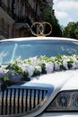 White wedding limousine decorated with rings Royalty Free Stock Photo