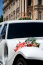 White wedding limousine with flowers Royalty Free Stock Photo