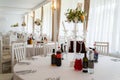 White wedding table set with a flower decoration.