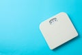 White weigh scales on blue background