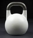 White weightlifting kettlebell in a gym