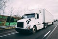 White 18 wheeler semi-truck on highway with motion blur Royalty Free Stock Photo