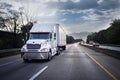 White 18 wheeler truck on highway at night Royalty Free Stock Photo
