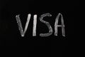 White white lettering on black Visa blackboard