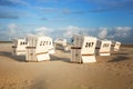 White wicker beach chairs on the beach Royalty Free Stock Photo