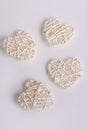 White wicker hearts on a white background