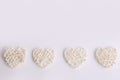 White wicker hearts on a white background