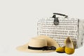 White wicker suitcase, womens hat, sunglasses and yellow shoes. Royalty Free Stock Photo