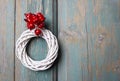 White wicker wreath on wooden door Royalty Free Stock Photo